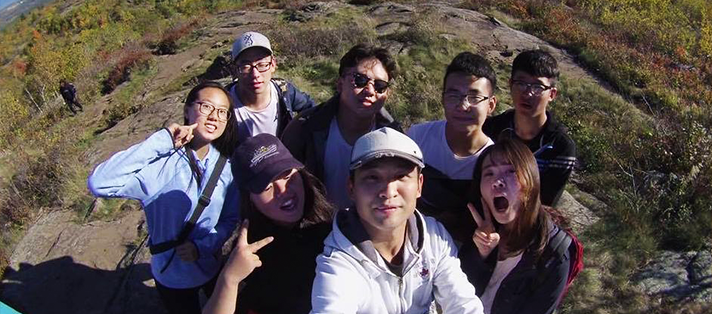 Peer mentor with students on a hike